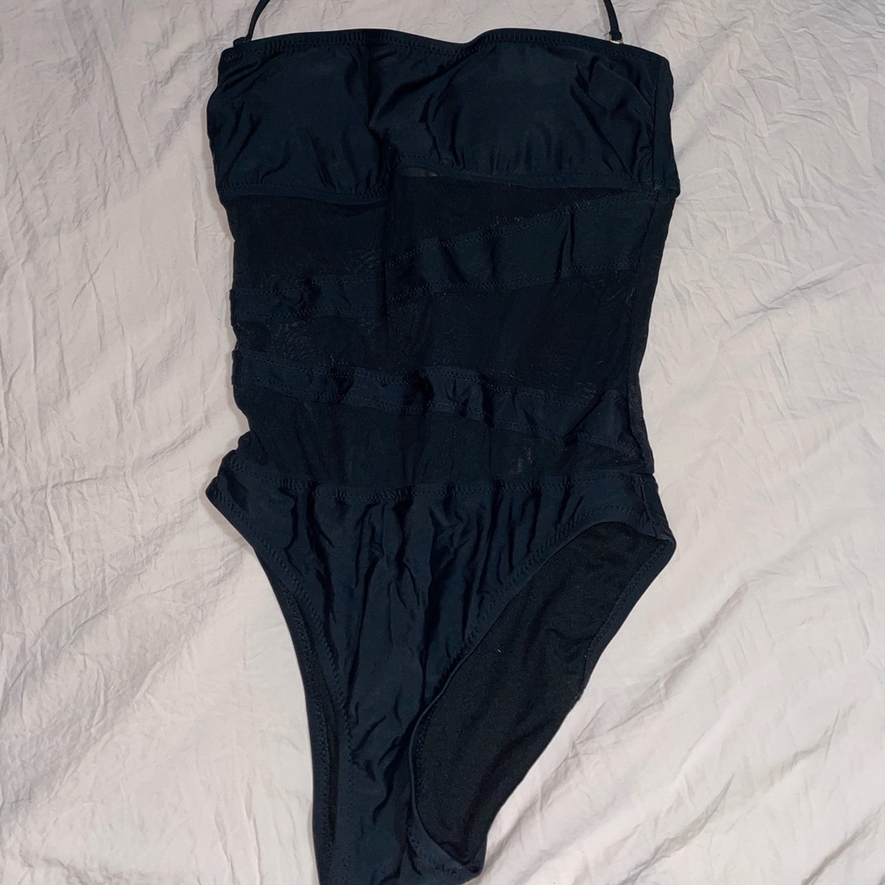 One-piece black bathing suit with mesh cutouts